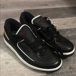 Air Jordan 2 retro Black and White with gold trim in back Sneakers